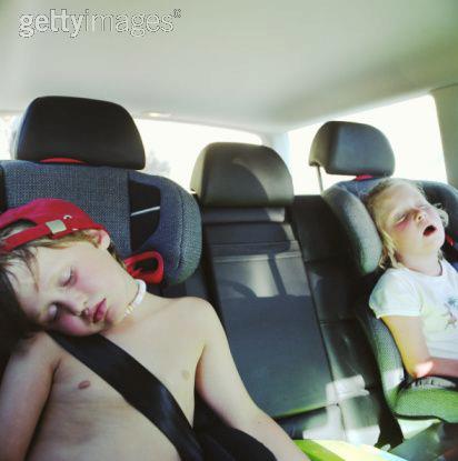 IMAGE BANK FAIL Twin boy and girl asleep in back of car - © Spike Mafford